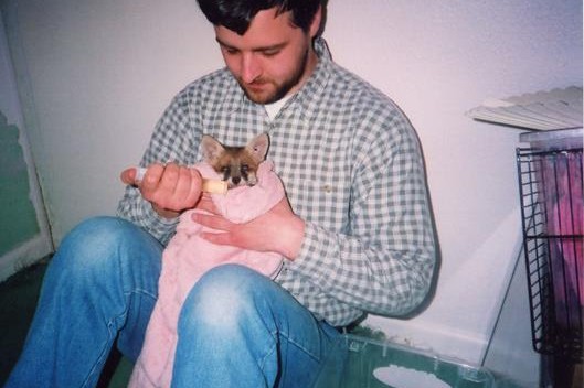 Trevor feeding a fox cub at Peacehaven 2003